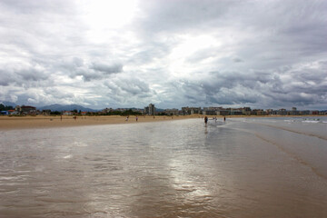 Serene Beach Under a Cloudy Sky