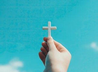 Holding Christian Cross Against Blue Sky Faith Hope and Love Concept
