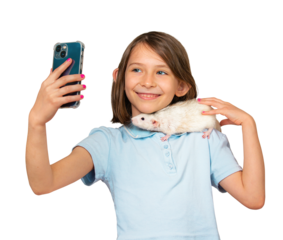Child holding white pet rat on shoulder and taking selfie on mobile phone, isolated on white background. A cute young girl with a pet rat.