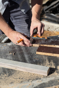 Hands of man measuring DIY project