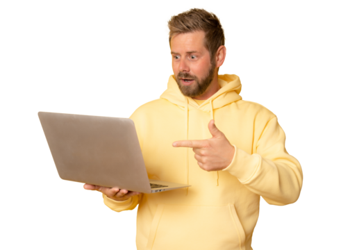 Portrait of a excited young man wearing casual clothes holding laptop computer isolated on transparent background.