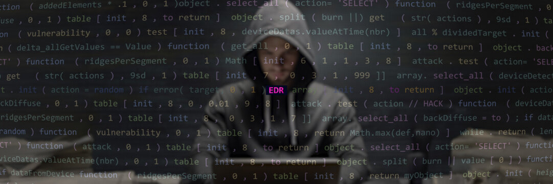 EDR text in foreground, anonymous hacker. Vulnerability endpoint detection and response system style, code on editor screen. English language, text in English