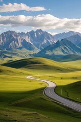 arafed road winding through a green valley with mountains in the background