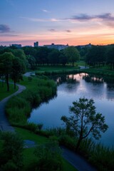 arafed view of a lake with a path and trees in the foreground