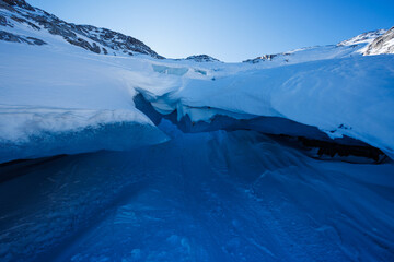 Pristine glacier ice formations create a natural frosty cave
