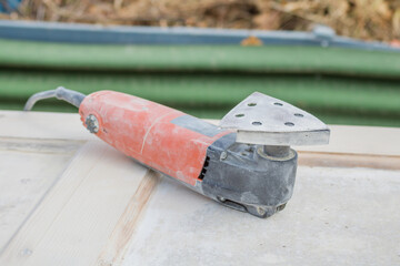 Electric tool with a grinding attachment
