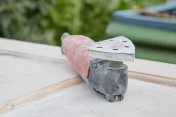 Electric tool with a grinding attachment