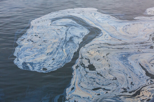 The view from above of a layer of oil, an oil slick on the waters of Puget Sound, an oil spill