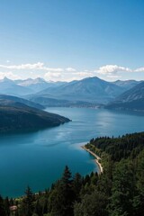 a view of a lake surrounded by mountains and trees