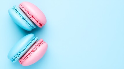 Colorful macarons neatly arranged against a light blue minimalist background