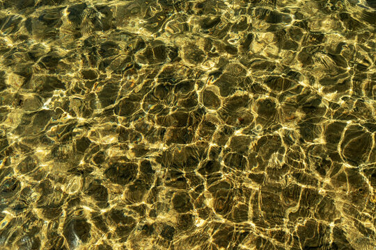 Clear lake water, patterns on the surface and reflections at Lake Tahoe.