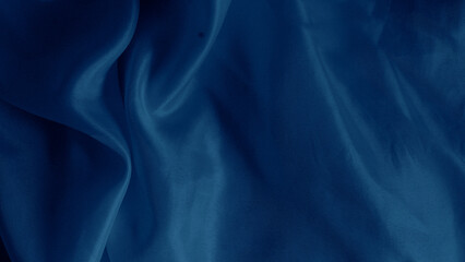 Elegant blue silk fabric draped gracefully with a soft iridescent shine.
