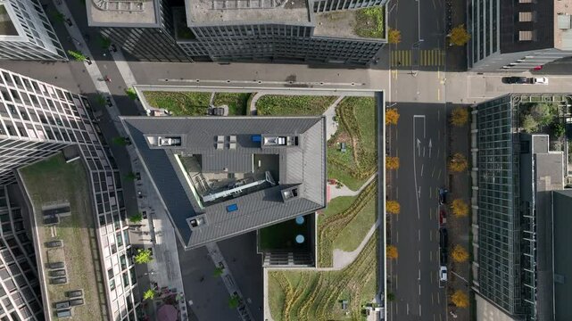 day time flight over zurich city center modern office complex rooftop traffic street crossroad aerial panorama 4k switzerland  