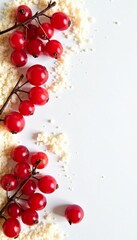 Vibrant red currant berries surrounded by granulated sugar on white background, vibrant, berry