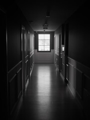 Dark Corridor with Light from Window in Black and White