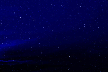 Fototapeta premium Starry night sky. Colourful galaxy space. Glowing stars in the night. New Year, Christmas and celebration background concept