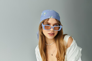 Stylish young woman showcases spring fashion in serene studio setting