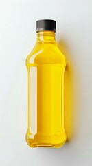 Fototapeta premium A clear plastic bottle filled with golden yellow liquid, showcasing oil or beverage, ideal for food packaging concepts and culinary use.