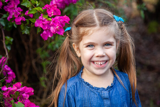 Happy little girl with gap in teeth from first lost tooth