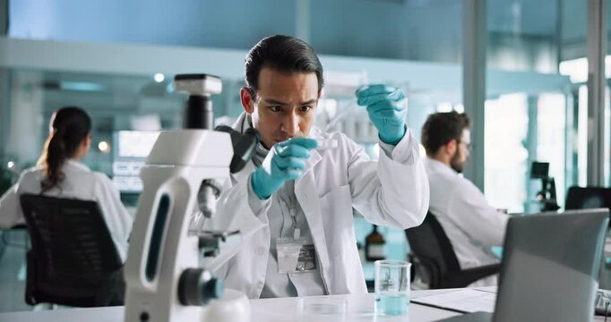 Beaker, scientist or man with vial in lab for science breakthrough, clinical trial or discovery. Laptop, medical or liquid for checking results on experiment for vaccine research, cure or development