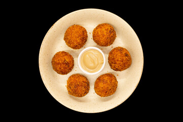 Starter of dumplings with sauce.