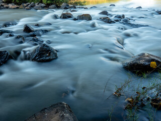 Ethereal Stream: Rocks in Motion
