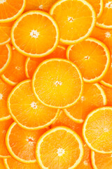 Slices of oranges close-up. Vertical photo. Top view.