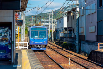 Local train arrive to railway station platform in Kyoto Japan. Train transportation concept.