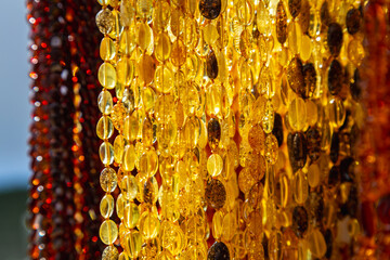 Amber Beads in a Street Shop. Orange Baltic Sea Souvenir, Natural Jewelry, Gold Brown Stone Necklace