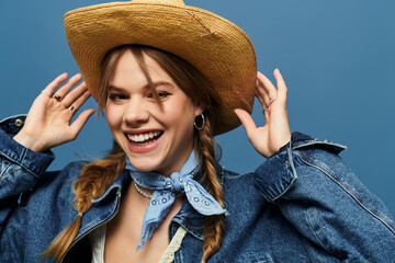 Stylish young woman enjoying spring vibes in a studio setting with a blue background