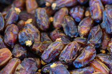 Discovering the rich textures and colors of fresh dates at a vibrant market in the heart of the desert