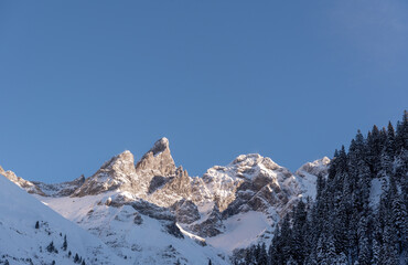 Naklejka premium Snowy mountain peak close-up, on a December sunny day, in the Bavarian Alps