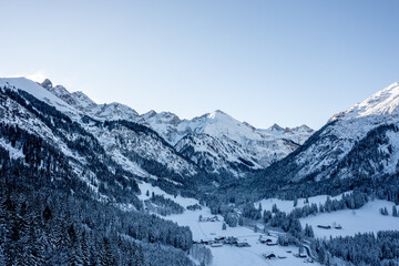 Snowy valley in December, drone aerial view in the Bavarian Alps, Germany