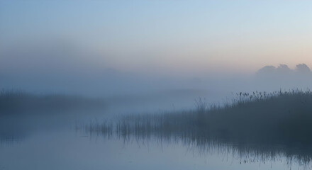 Misty Sunrise Over Calm Lake Landscape