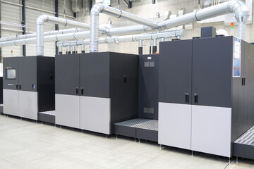 High volume industrial inkjet printer for reels of paper