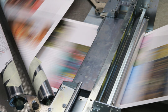Industrial colors printing machine working on continuing reels of paper with modern inkjet technology