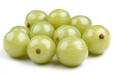 Fresh green gooseberries arranged on a white background showcasing their smooth surface and vibrant color