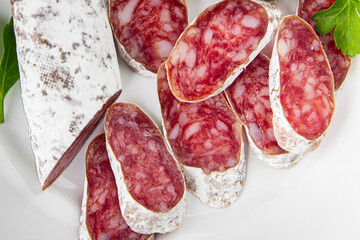 Fuet sausage Spanish meat delicacy fresh delicious gourmet food background on the table rustic food...
