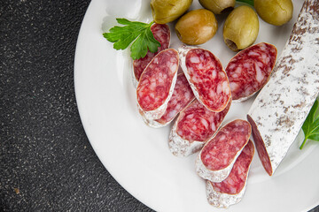Fuet sausage Spanish meat delicacy fresh delicious gourmet food background on the table rustic food top view copy space
