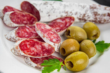Fuet sausage Spanish meat delicacy fresh delicious gourmet food background on the table rustic food top view copy space