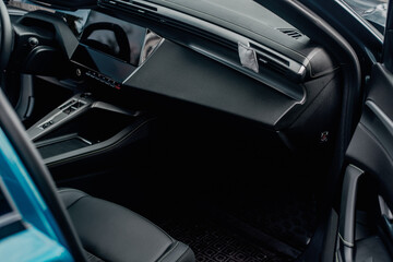 Naklejka premium Modern car interior featuring dashboard, steering wheel and screen