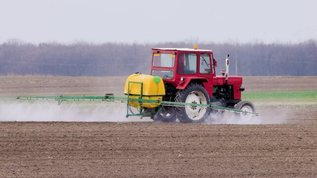 an agricultural machine that spreads herbicide on a field