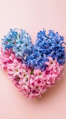 Fototapeta premium Vibrant floral arrangement set against a soft pink backdrop