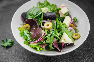 Salad with olives, cheese and green leaves fresh delicious gourmet food background on the table rustic food top view copy space keto and paleo diet vegetarian  food