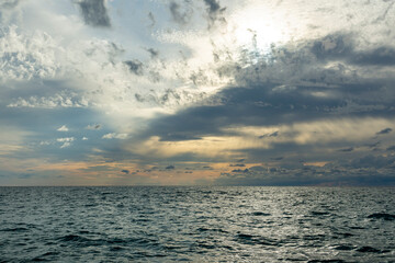 Beautiful sunset. Warm summer evening on the Black Sea coast. The sea is calm, the sea is smooth and calm.