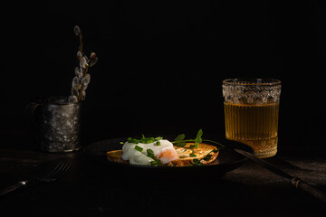 poached egg on dark background