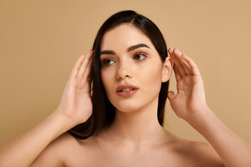 Fototapeta premium Glowing beauty exudes confidence in studio setting with flawless skin