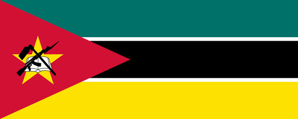 Mozambique flag waving proudly in the breeze over a vibrant landscape