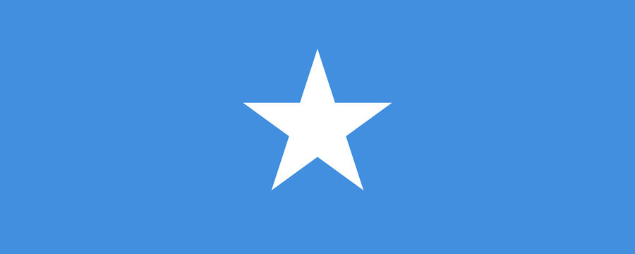 Flag of Somalia waving against a clear blue background symbolizing national pride and identity in a vibrant setting