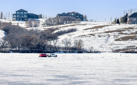 Lonely ice fishing shack in late March at Blackstrap Lake, Saskatchewan, Canada